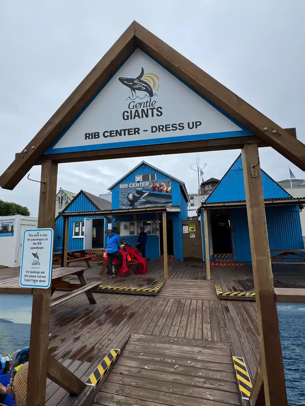Blue building with Gentile Giants Rib Center sign on dock